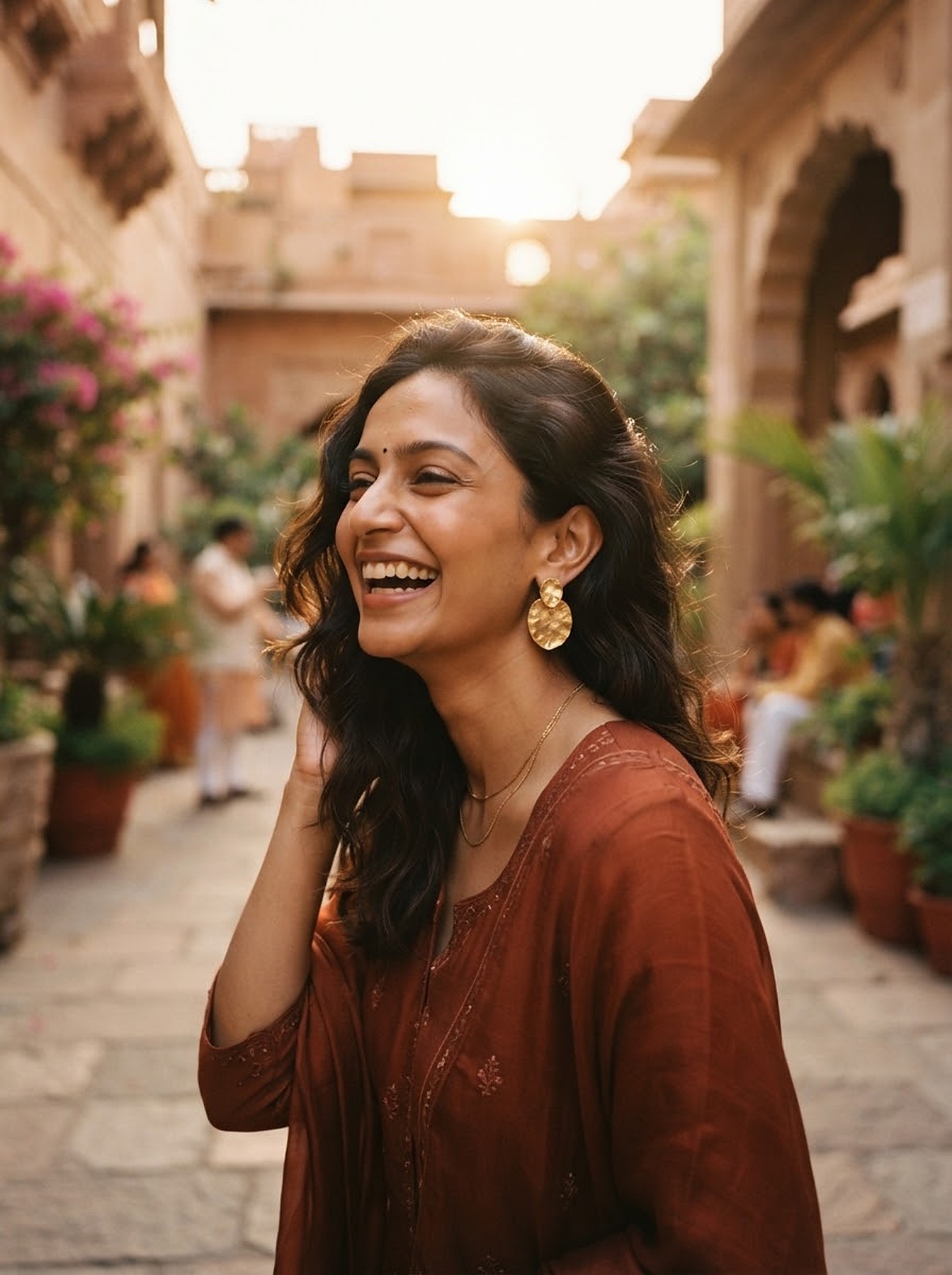 Portrait in golden hour sunlight wearing gold earrings